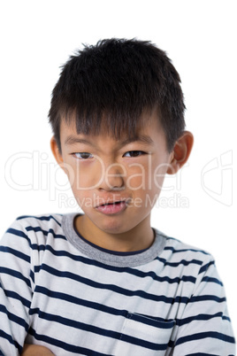 Boy standing against white background