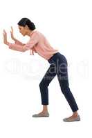 Female executive listening secretly on white background