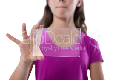 Teenage girl using glass digital tablet against white background