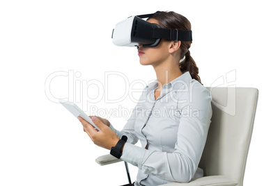 Female executive using virtual reality headset