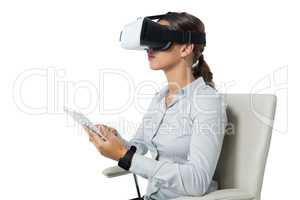 Female executive using virtual reality headset