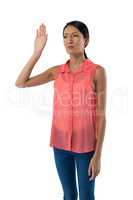 Woman gesturing against white background