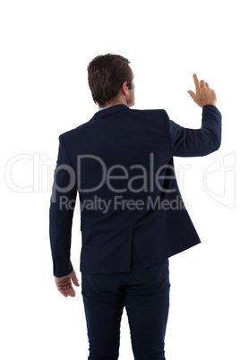 Businessman pressing an invisible virtual screen