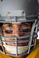 Close-up of American football player wearing helmet