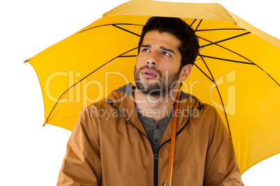 Man standing under umbrella Man standing under umbrella