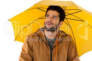 Man standing under umbrella