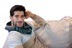 Portrait of smiling man relaxing on sofa