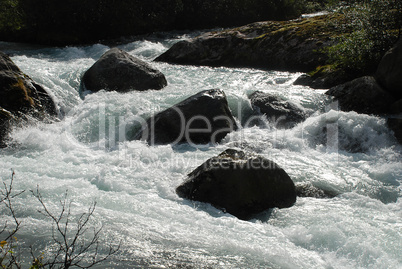 River rapids nearby the Briksdal Glacier (Olden, Norway).