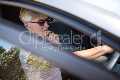 Senior woman driving a car