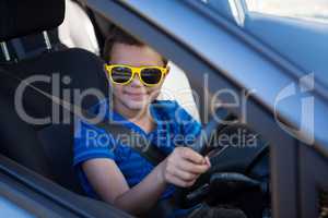 Teenage boy driving a car