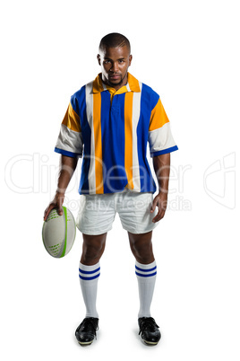 Portrait of confident rugby player holding ball