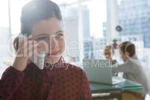 Girl as business executive talking on mobile phone