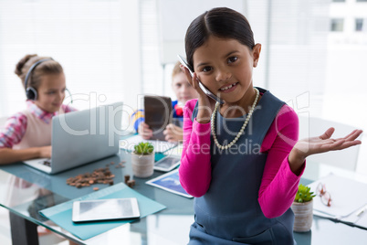 Girl as business executive talking on mobile phone