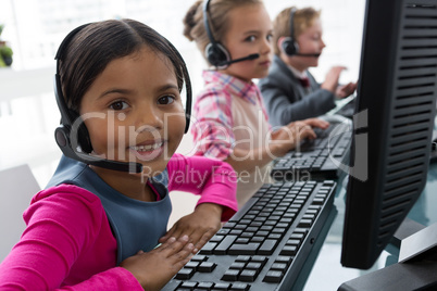 Girl as customer care executive smiling while working in the office