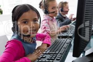 Girl as customer care executive smiling while working in the office
