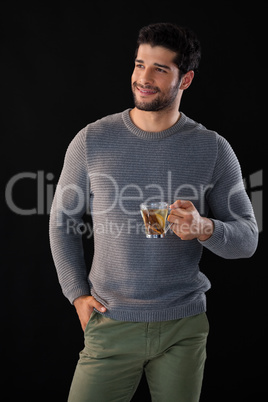 Thoughtful man holding a cup of lemon tea