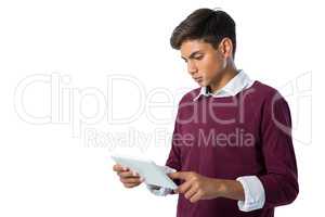 Teenage boy using digital tablet