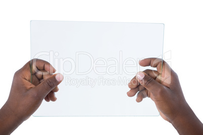 Hand holding a glass digital tablet