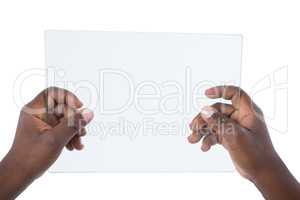 Hand holding a glass digital tablet