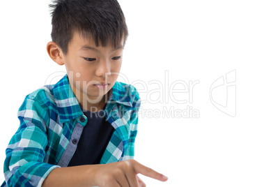 Boy pretending to touch an invisible screen