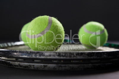 Close up of tennis balls on racket