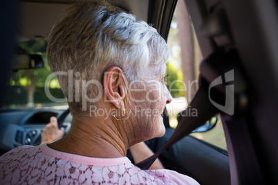 Senior woman driving a car