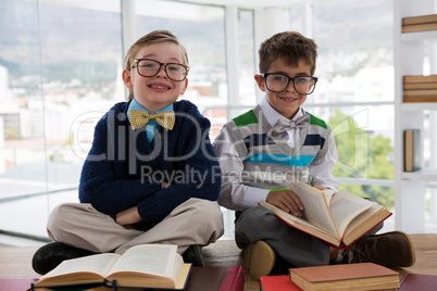 Kids as business executive sitting on a table