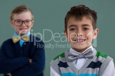 Kids as business executive smiling while standing in office