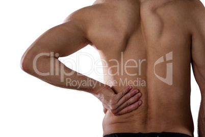 Midsection of shirtless sports player suffering from pain