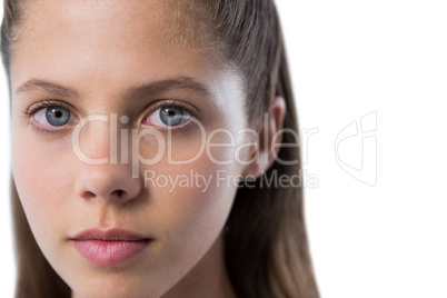 Confident teenage girl standing against white background