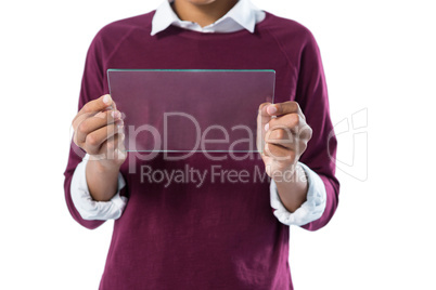 Teenage boy using glass digital tablet against white background