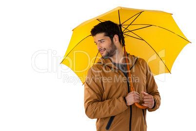 Man standing under umbrella