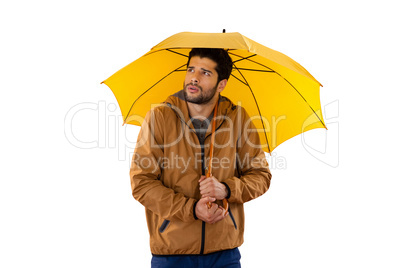 Man standing under umbrella