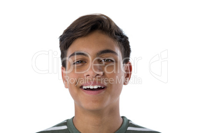 Smiling teenage boy against white background