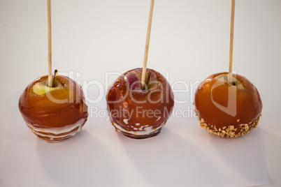 Close-up of three decorated apple