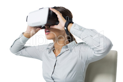 Female executive using virtual reality headset