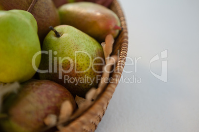 Close-up of pears in wicker basket