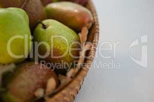 Close-up of pears in wicker basket