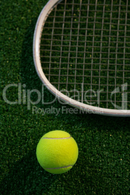 Cropped image of racket by tennis ball