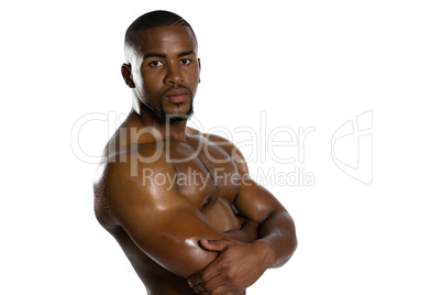 Portrait of shirtless sportsman with arms crossed