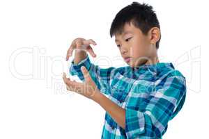 Boy pretending to hold invisible object