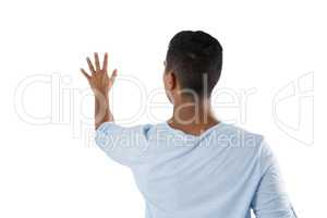 Man pretending to touch an invisible screen against white background