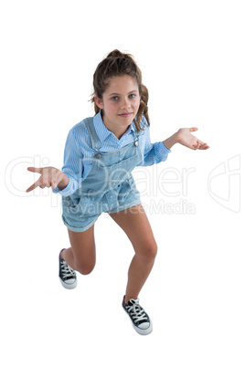 Teenage girl gesturing on white background