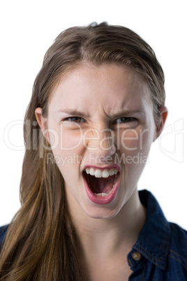 Teenage girl shouting against white background