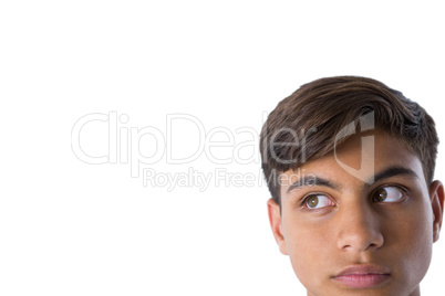 Thoughtful teenage boy looking away