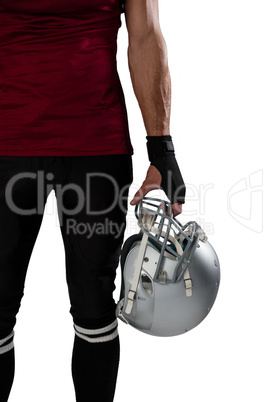 Cropped image of football player holding helmet