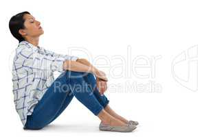 Woman relaxing against white background