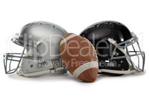Close up of American football with helmets