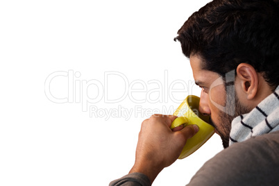 Thoughtful man having a mug of coffee