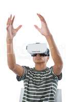 Teenage boy using virtual reality headset